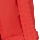 Close-up of a red jacket with a button on a white background