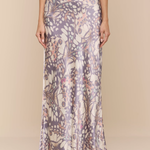 Long floral-patterned dress on a plain background