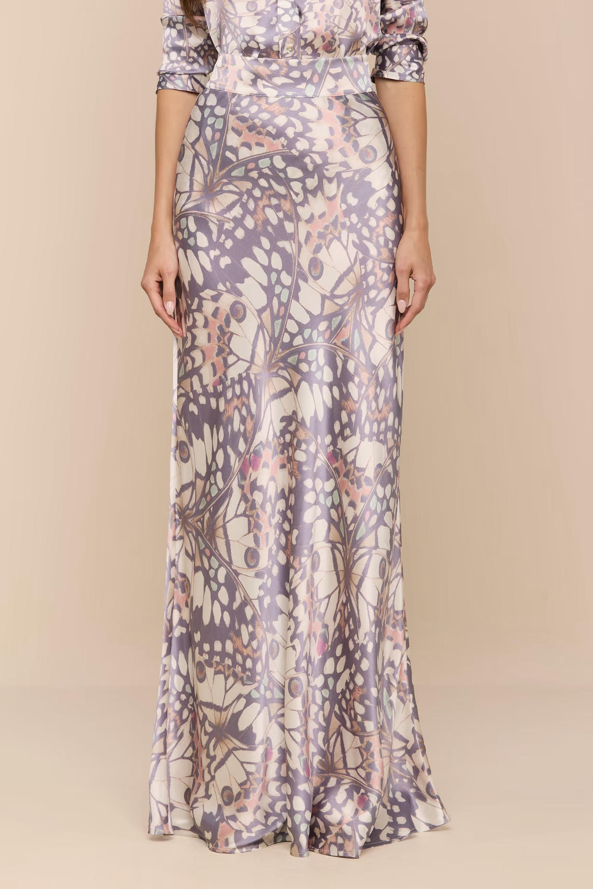Long floral-patterned dress on a plain background