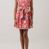 woman in floral dress on white background 