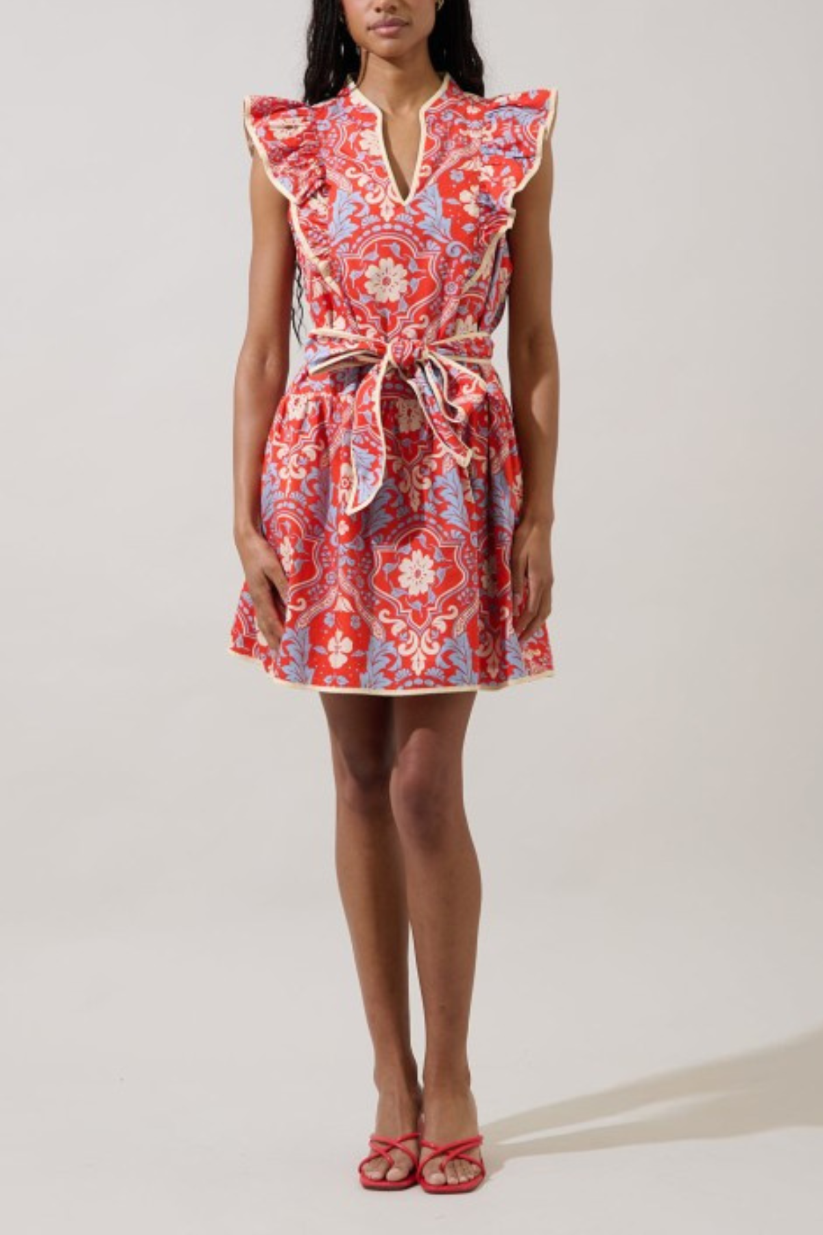 woman in floral dress on white background 