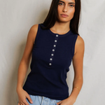 woman  in navy sleeveless top 