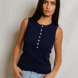 woman  in navy sleeveless top 