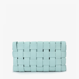 blue woven clutch on white background 