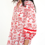 red printed long sleeve blouse  modeled against a white background