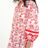 red printed long sleeve blouse  modeled against a white background