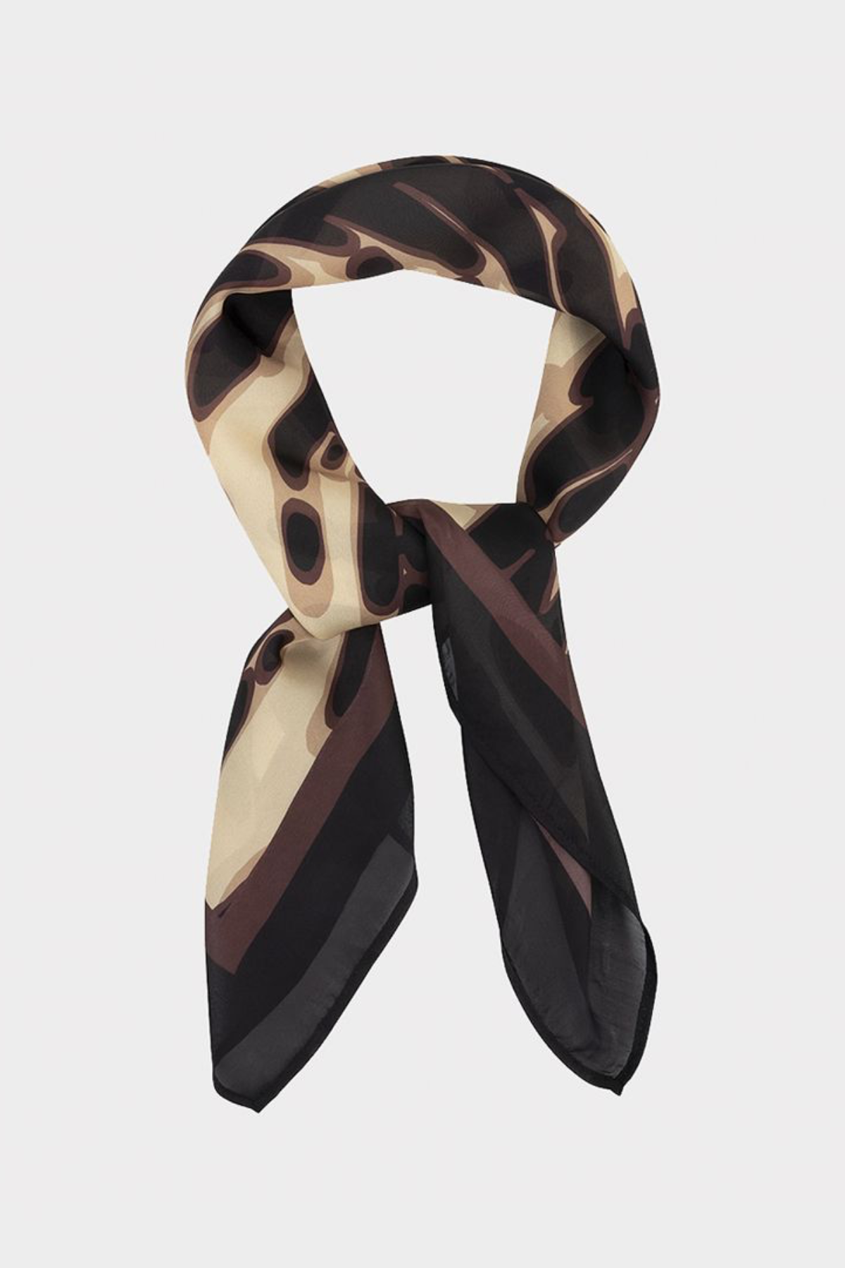 A lightweight silk scarf with an abstract organic pattern in black, dark brown, and beige, styled in a loop on a light gray background.