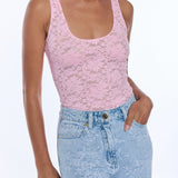 woman in pink lace tank top and denim 