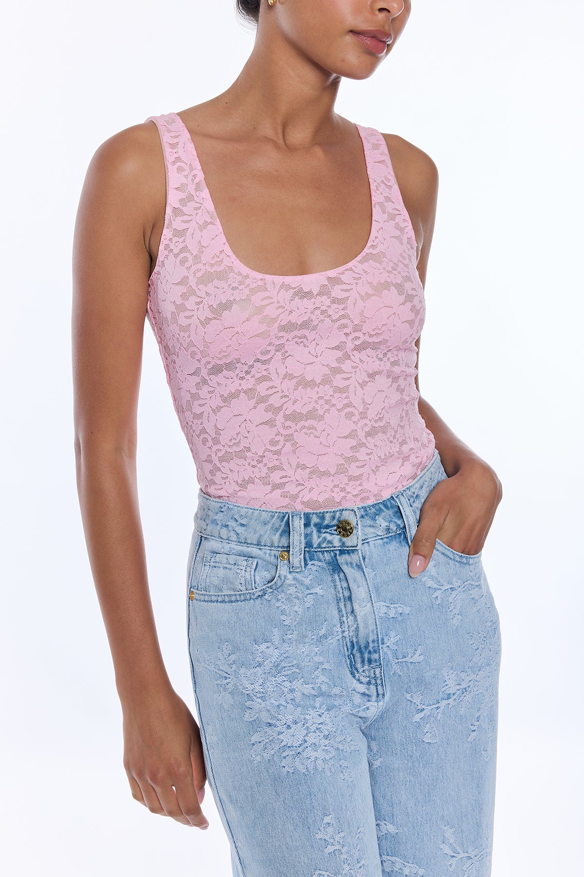 woman in pink lace tank top and denim 
