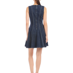Woman wearing a denim dress on a white background