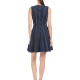 Woman wearing a denim dress on a white background