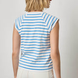 Woman wearing a blue and white striped sleeveless top against a plain background