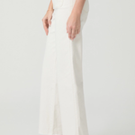 White pants worn by a person on a white background