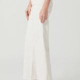 White pants worn by a person on a white background