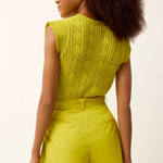 back of woman in green set 