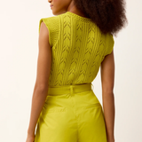 back of woman in green set 