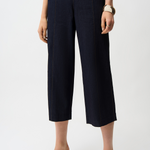 Navy blue wide-leg pants worn by a person on a white background