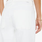 White pants worn by a person on a white background