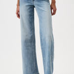 Light blue jeans worn by a person on a white background