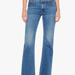Blue jeans worn by a person on a white background
