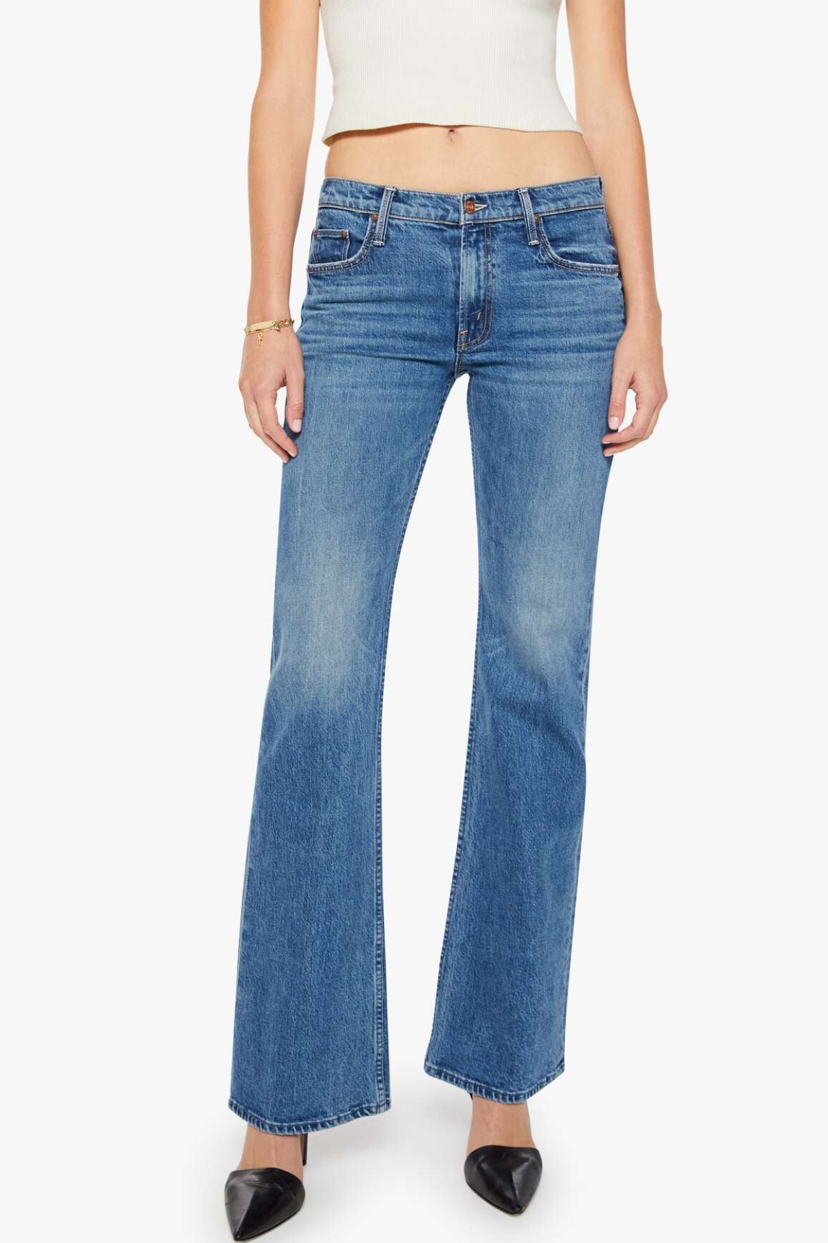 Blue jeans worn by a person on a white background