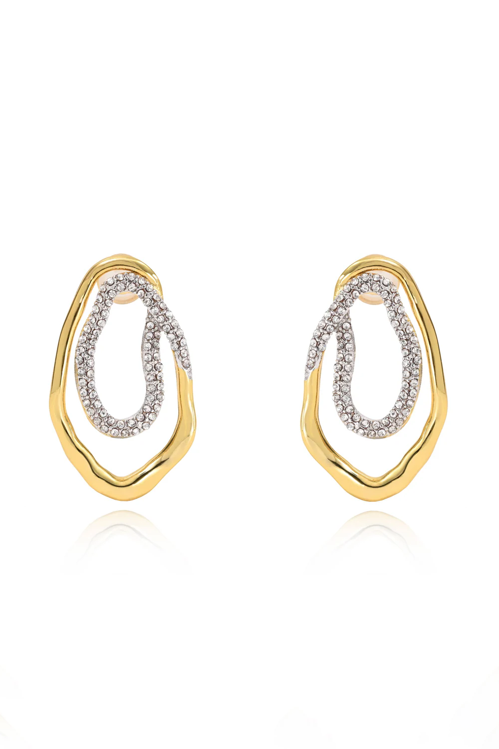 Gold and silver earrings on a white background