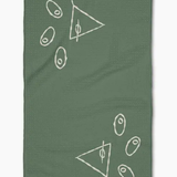 A sage green waffle-weave kitchen towel featuring white minimalist line-art drawings of martini glasses with olives, shown flat against a white background.