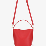 Red handbag with a strap on a white background