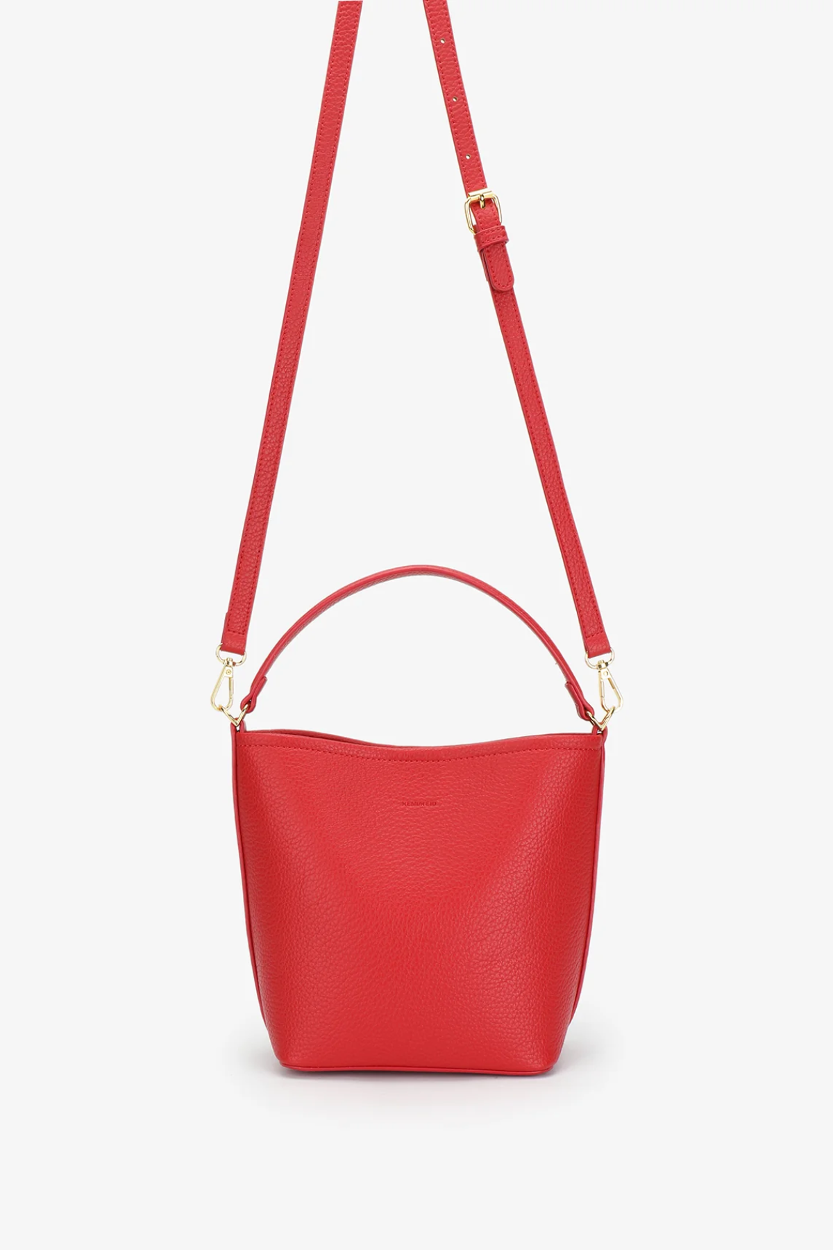 Red handbag with a strap on a white background