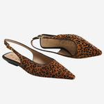 A pair of pointed-toe slingback flats in brown and black leopard print, shown on a light gray background. The brand name 'SOMMER CAESAR' is visible on the insole.