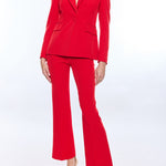 Red suit worn by a person on a white background
