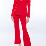 Red suit worn by a person on a white background