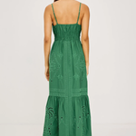 Green dress with intricate patterns on a white background