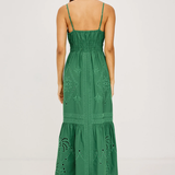 Green dress with intricate patterns on a white background