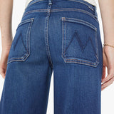 Blue jeans worn by a person on a white background