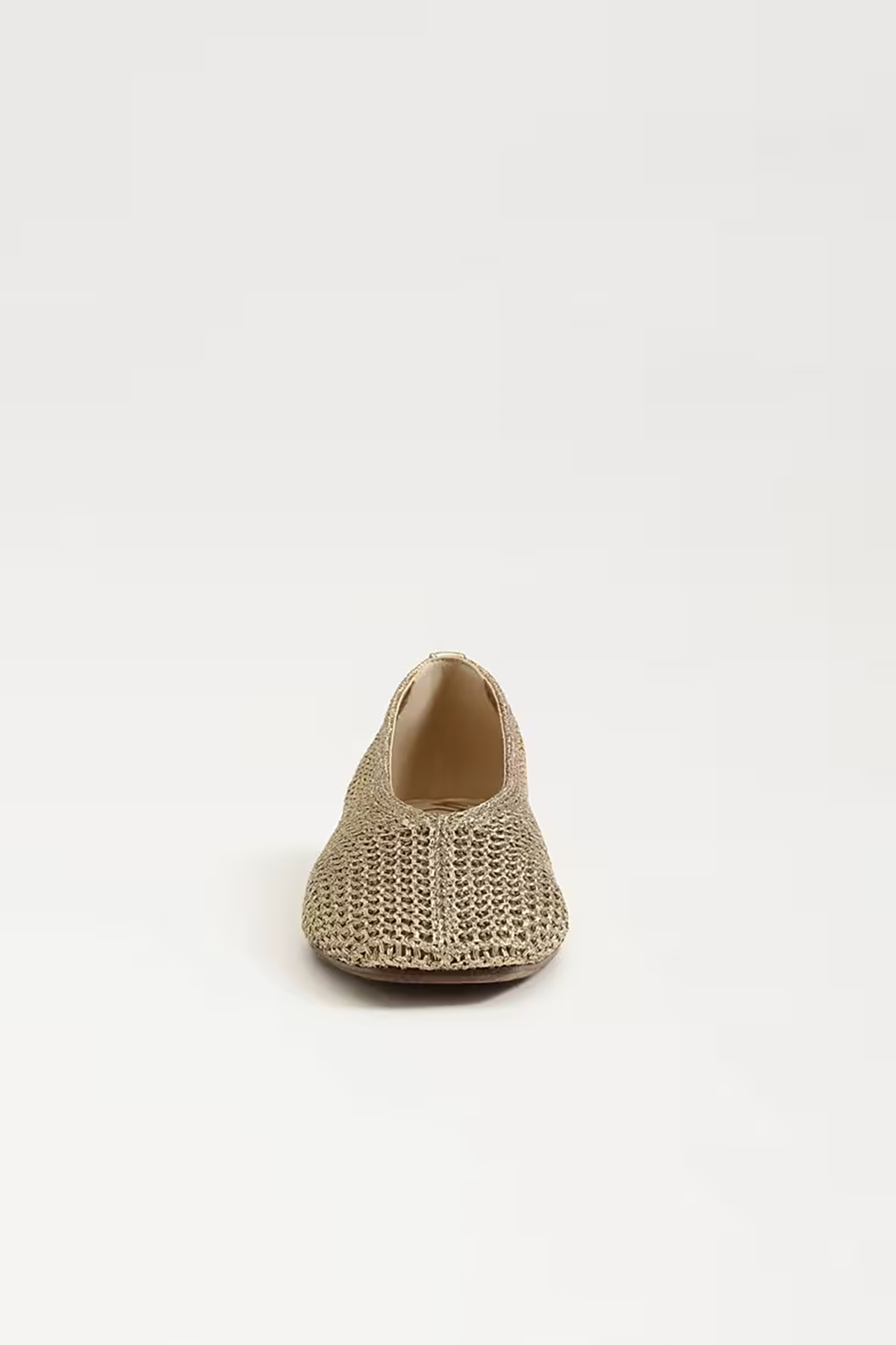 Beige woven shoe on a white background