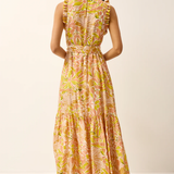 Woman wearing a floral dress on a plain background