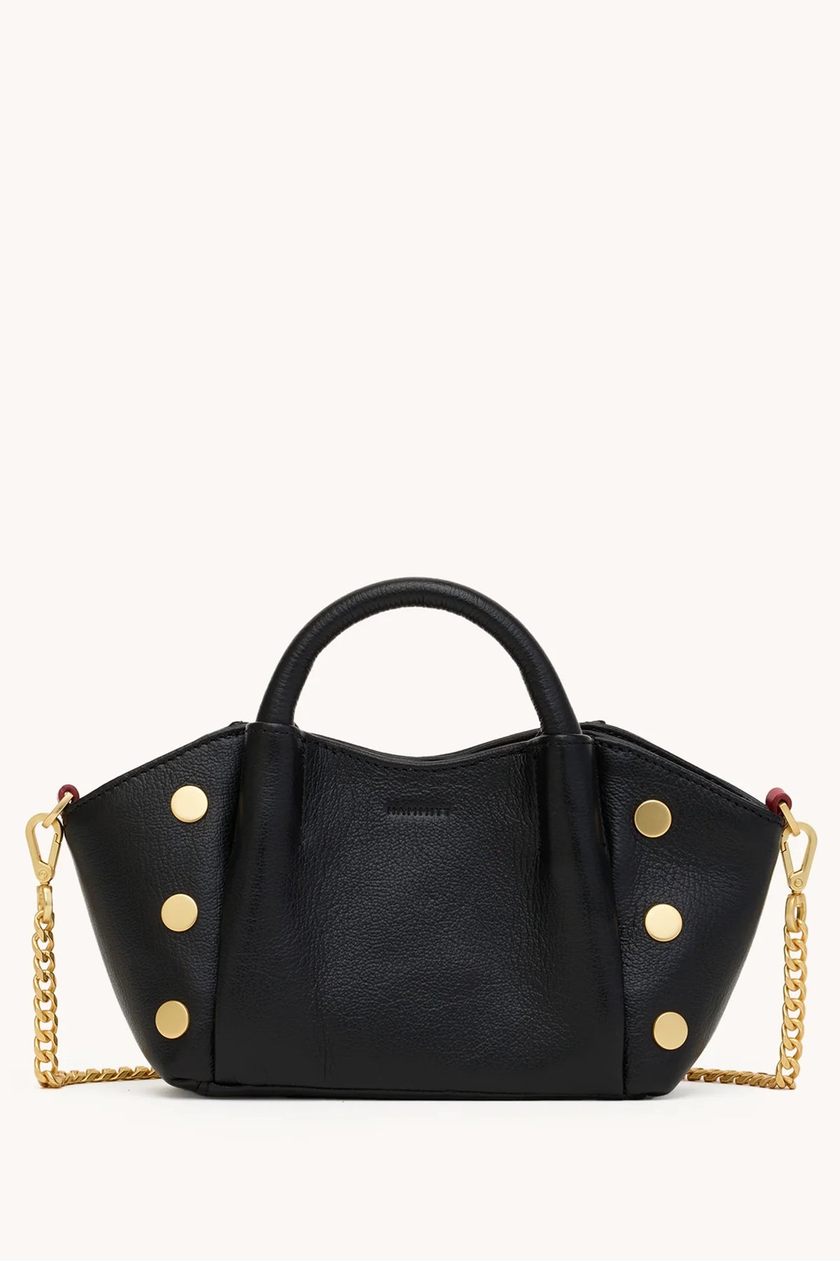 Black Hammitt Paul Mini crossbody bag worn with an evening outfit.