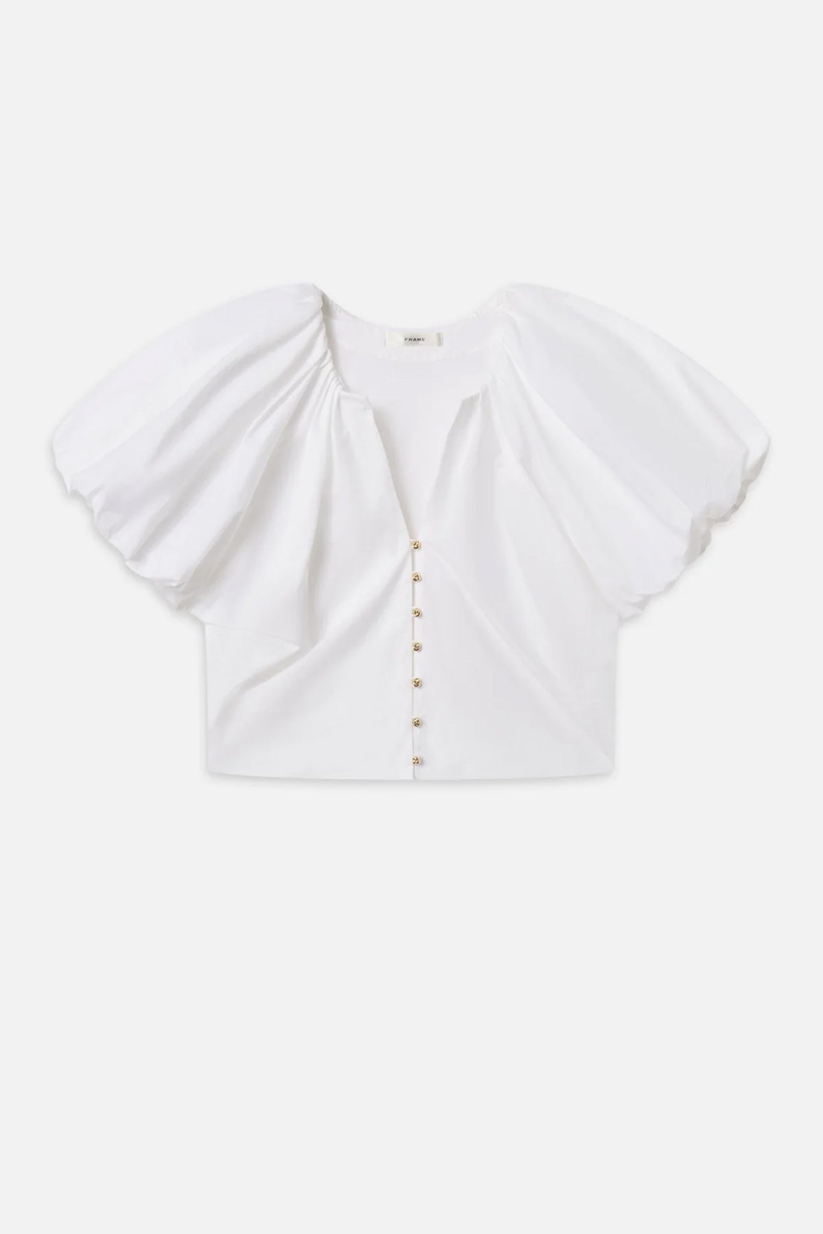 Blouse with dramatic voluminous sleeves styled with denim