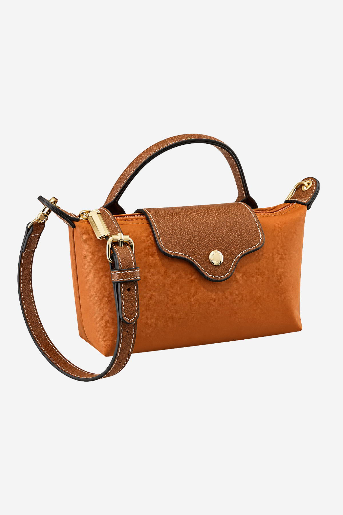 A structured leather handbag in warm camel brown with a darker brown flap, gold-tone hardware, a top handle, and a detachable shoulder strap, shown on a light gray background.