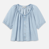 Light blue denim blouse on a white background