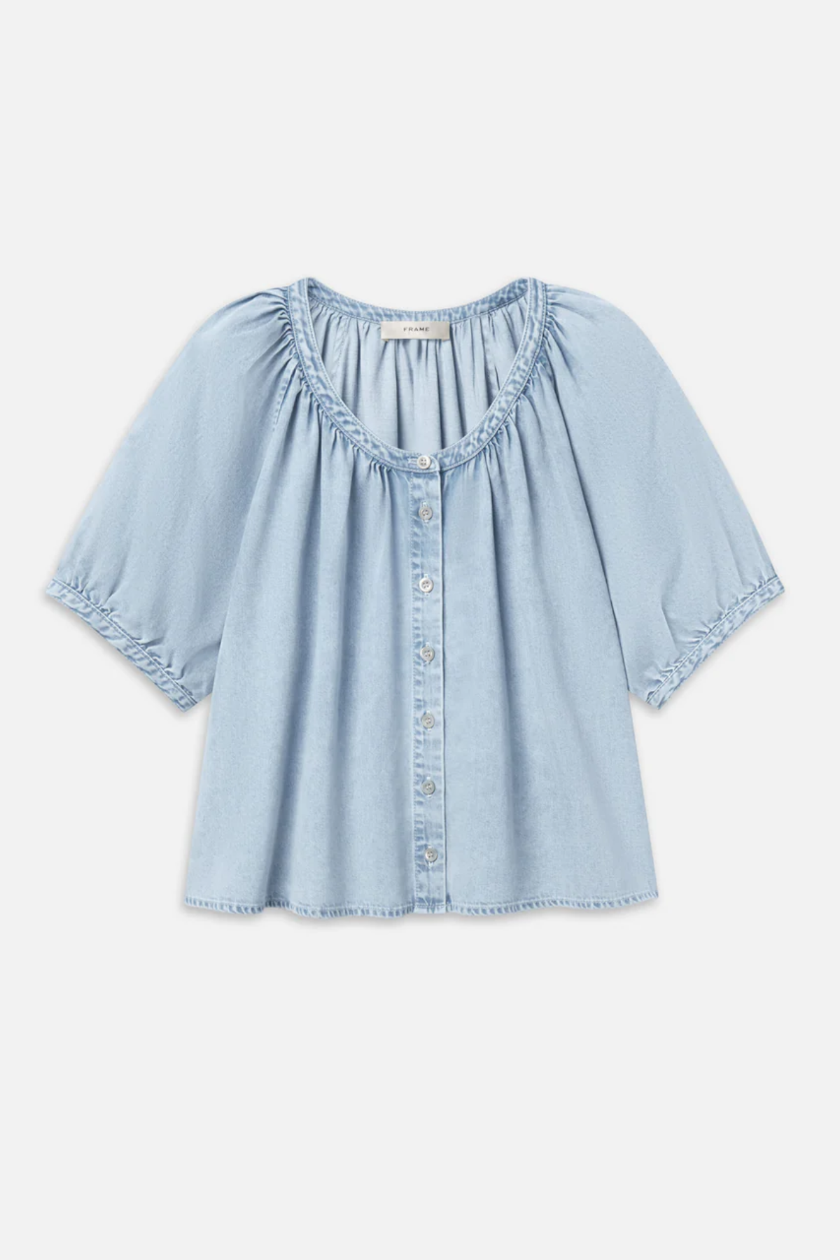 Light blue denim blouse on a white background