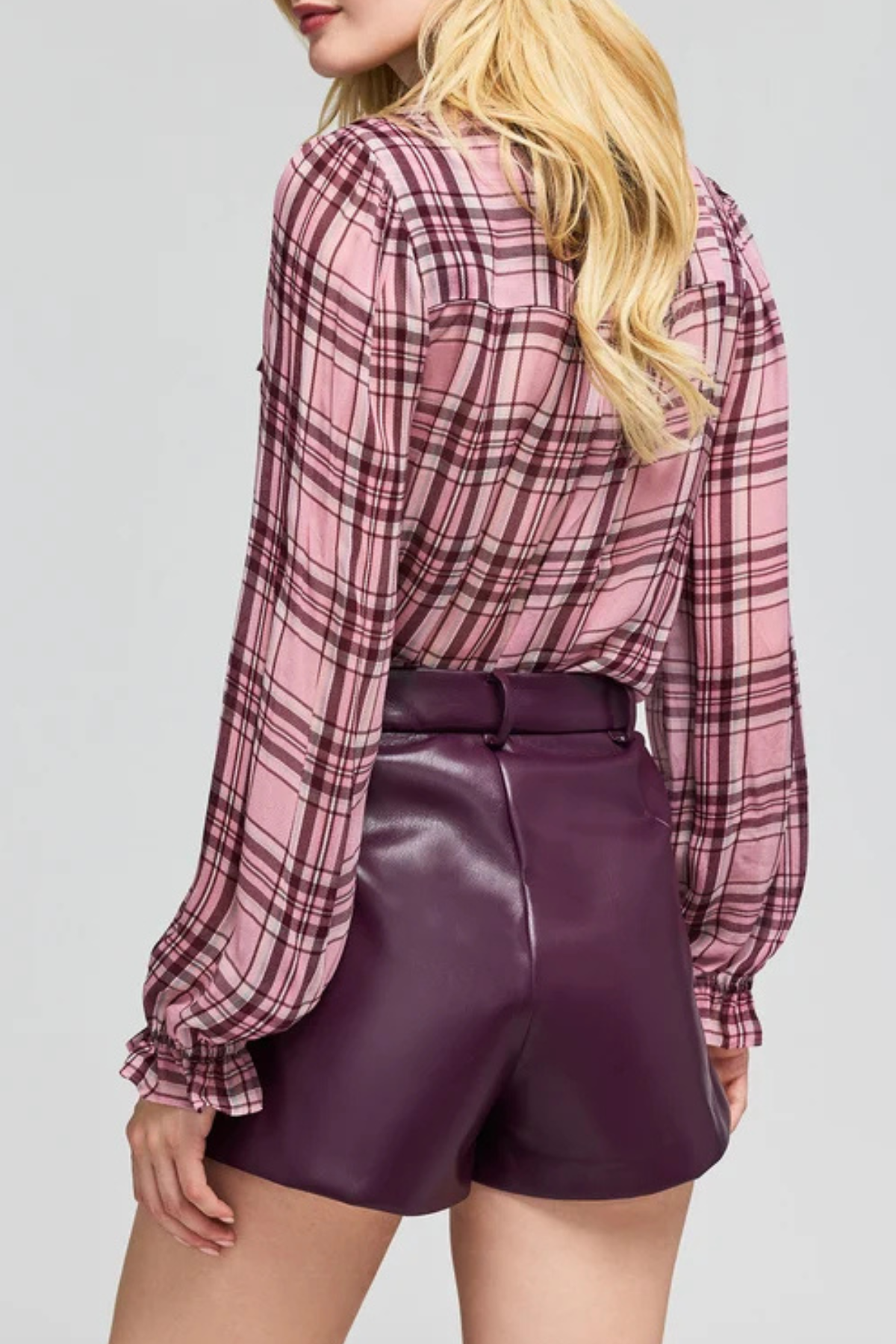 Women's plaid blouse featuring long sleeves, a relaxed silhouette, and multicolor pattern.