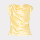 Yellow satin top on a light gray background