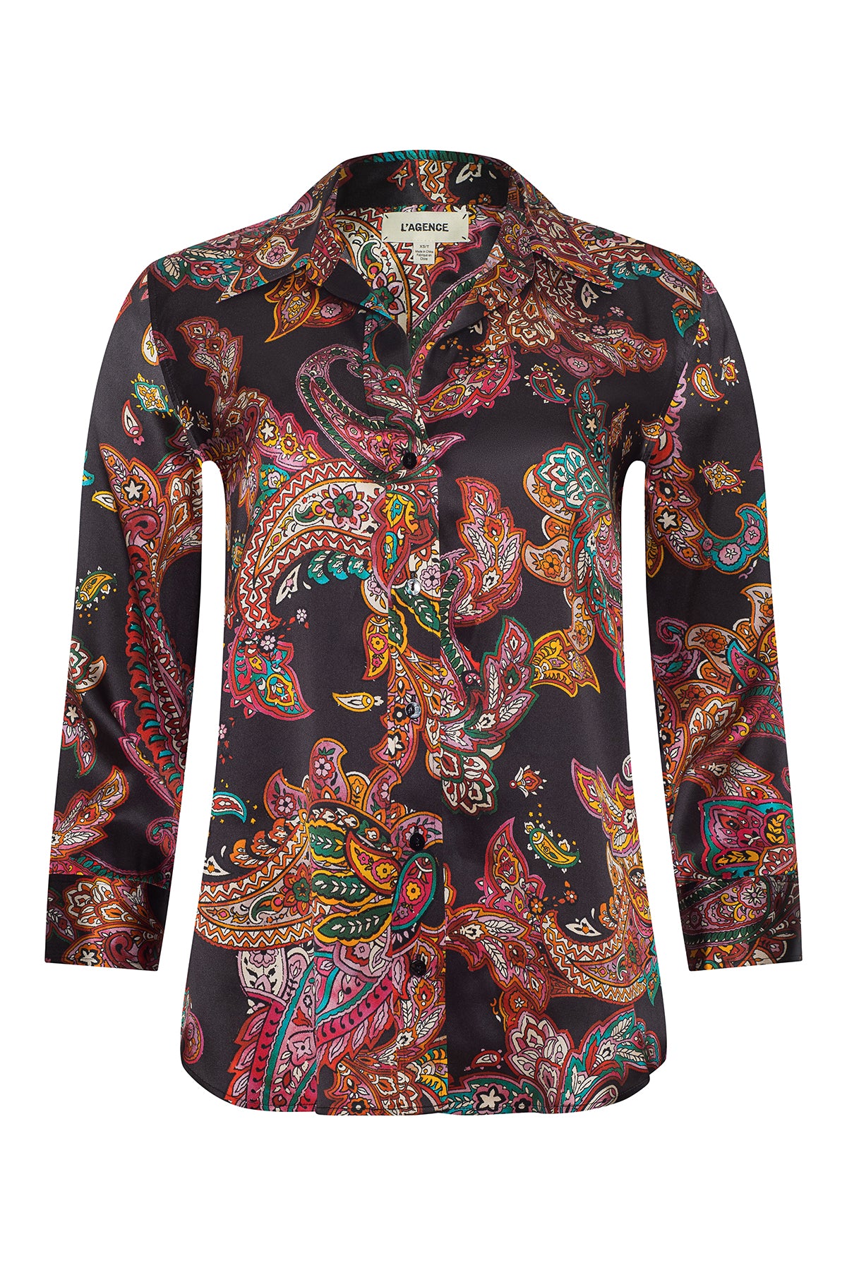 Person wearing l'agence  patterned shirt and jeans on a gray background