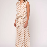 Woman wearing a polka dot dress on a white background