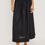 Person wearing a black skirt on a white background