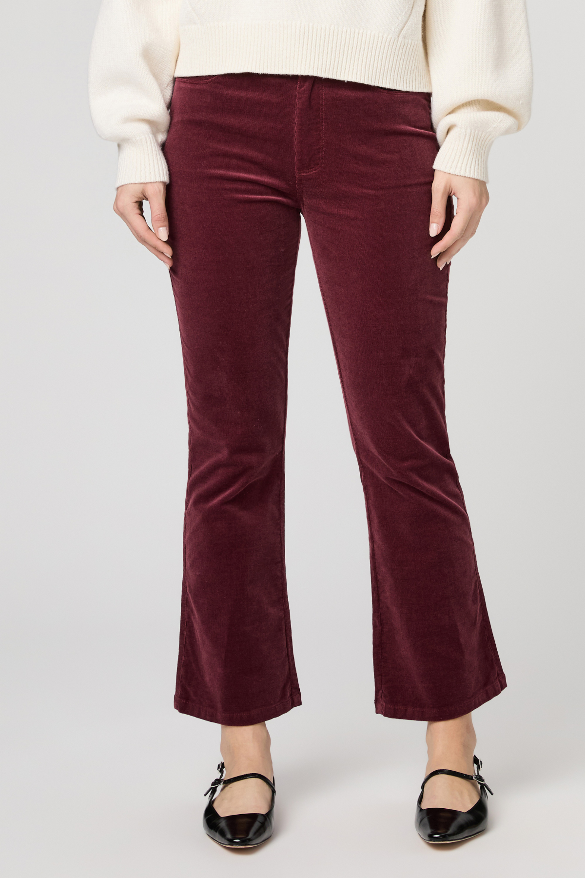 Women's pinot cropped bootcut jeans featuring a rich burgundy hue and flattering silhouette.