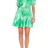 Green floral dress worn by a model on a white background
