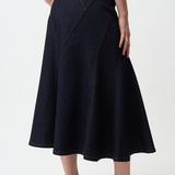 Person wearing a black skirt on a white background